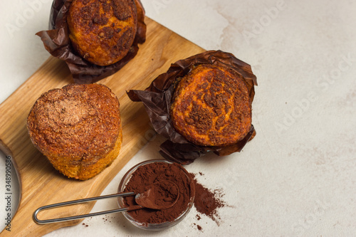 Different homemade muffins with chocolate and cacao and baking. Copyspace.