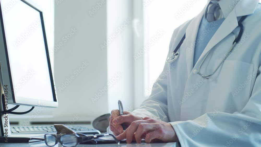 Professional medical doctor working in hospital office using computer technology. Medicine and healthcare. Professional medical doctor working in hospital office using computer technology. Medicine and healthcare.