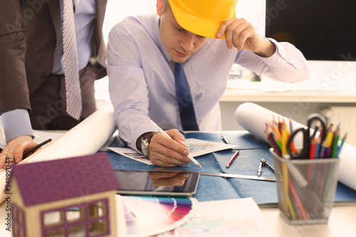 Two Engineer Architect Discussing House Project