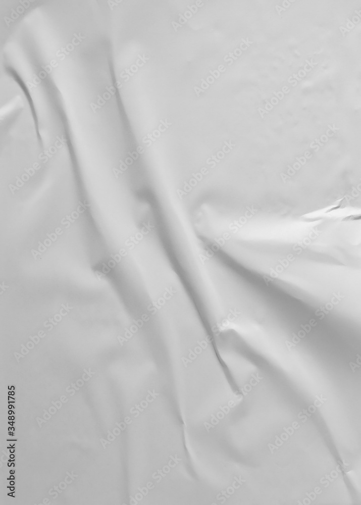 Obraz premium Glued paper for poster texture. Blank white crumpled and wrinkled paper template for background. Matted wet paper wrinkled for mockup posters