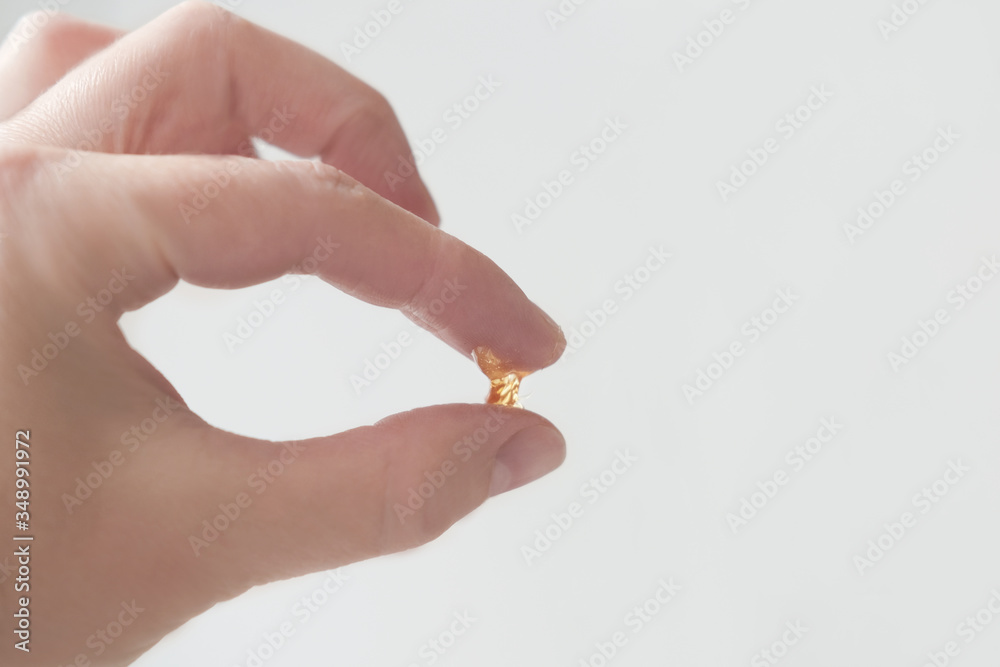 A piece of sugar paste for shugaring in a hand. homemade sugaring paste. temperature test of depilation wax, beauty and spa concept. A piece of sugar paste for shugaring in a hand. homemade sugaring paste. temperature test of depilation wax, beauty and spa concept.