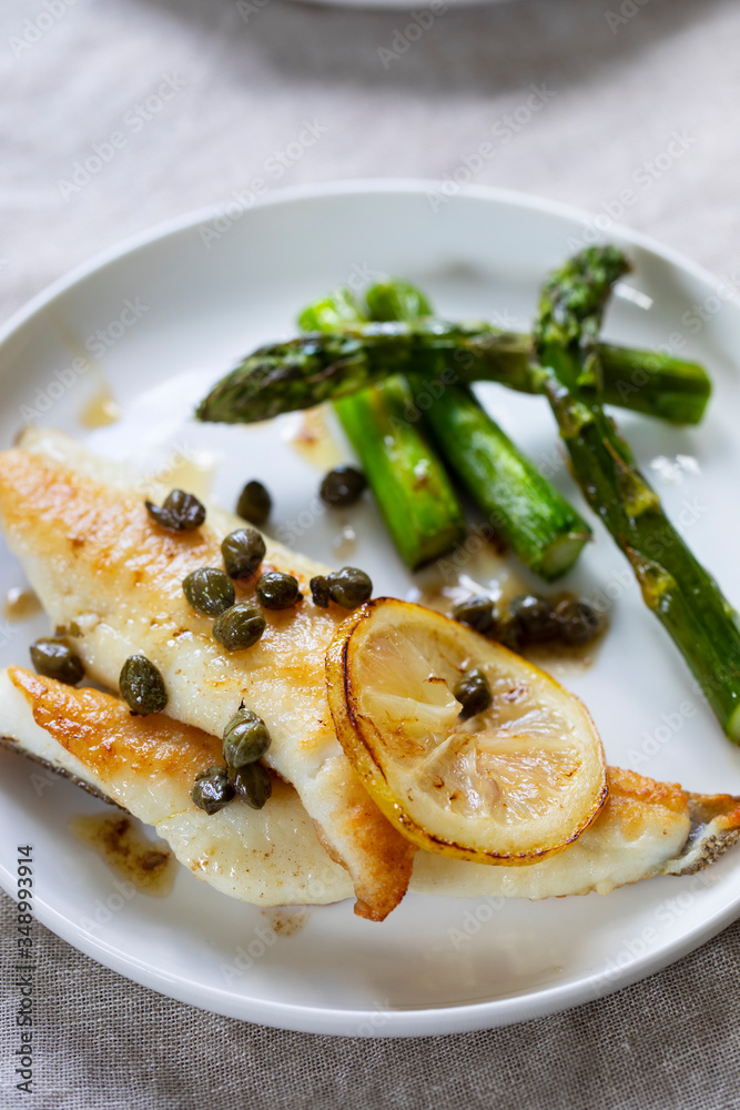 Lemon sole with butter and capers sauce and asparagus Lemon sole with butter and capers sauce and asparagus