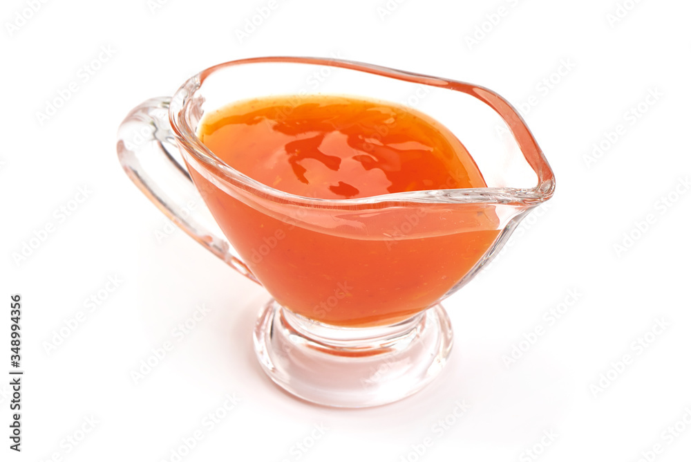 Sweet chili sauce in a gravy boat, isolated on white background Sweet chili sauce in a gravy boat, isolated on white background