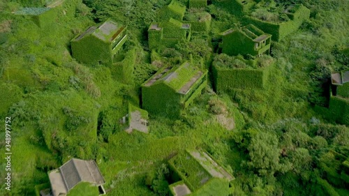 Houtouwan, Zhejiang China - Aerial view of China's abandoned fishing village. Plants Are Taking Over This Abandoned Fishing Village. photo