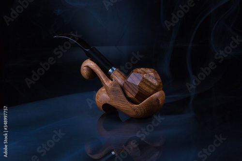 wooden Smoking pipe on a stand