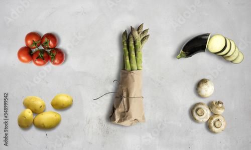 tomatoes, potatoes, asparagus, mushroom, courgette on a white chalk background