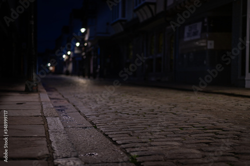 Empty Cobblestone street in Canterbury at night © Maude Foreman