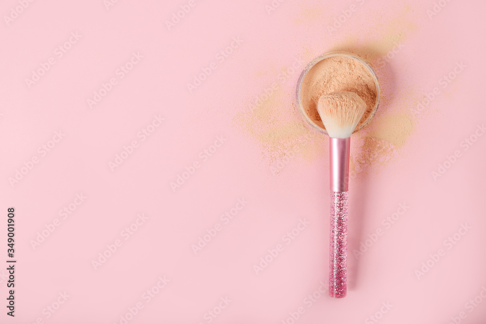 Brush and loose powder on a pink background. Place for text Brush and loose powder on a pink background. Place for text