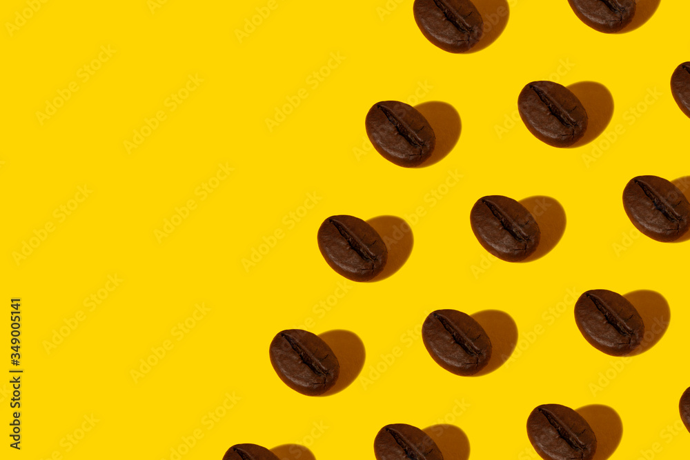 Creative bright collage of real macro photos of selected coffee beans on a yellow background with a hard shadow in the shape of a heart with a place for inscription. Creative bright collage of real macro photos of selected coffee beans on a yellow background with a hard shadow in the shape of a heart with a place for inscription.