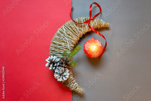 Making Christmas decorations. Original month with cones and fir branch. DIY concept. Step-by-step photo instructions. Finished crafts with decorative candles.