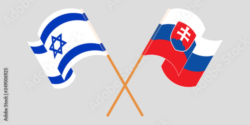 Crossed and waving flags of Slovakia and Israel