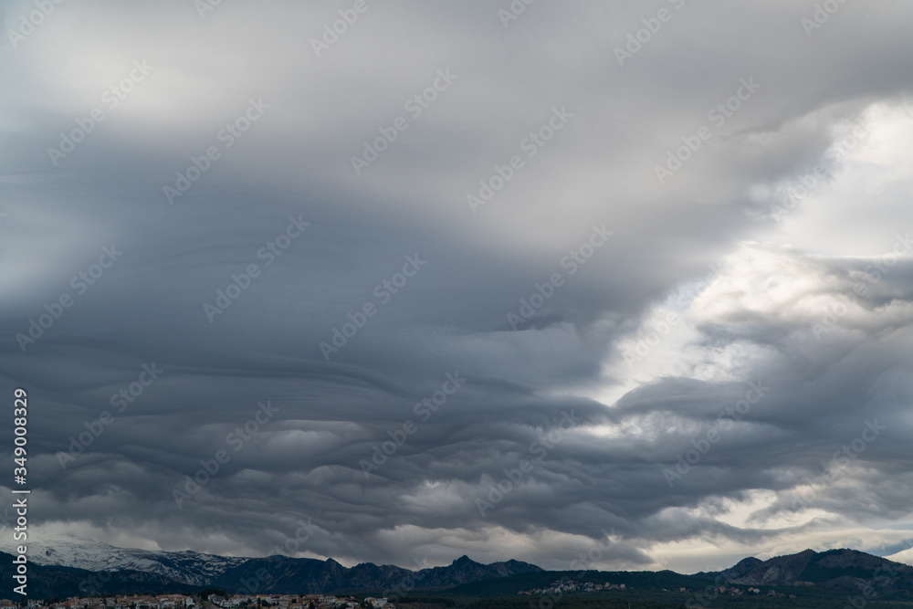 Dramatic sky. Interesting unusual lenticular clouds.