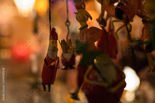 Christmas tree decoration/figures in a sale booth on a historic xmas market in Bremen, Germany with blurry Background and no people
