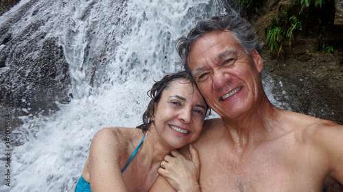 Couple Enjoying Themselves at a Waterfall in Mambia, Brazil