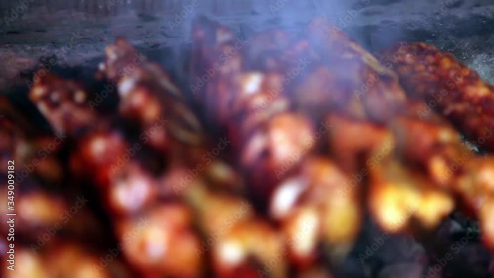 Cooking bread and meat on the fire. Healthy food cooked in national style in small rural restaurants on fire. Cooking bread and meat on the fire. Healthy food cooked in national style in small rural restaurants on fire.