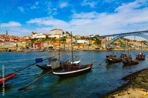 Porto  Portugal  Riberia old town cityscape with Dom Lusi bridge and the Douro River with traditional Rabelo boats