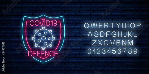 Coronavirus defence neon sign with alphabet. COVID-19 virus caution symbol in neon style. 2019-NCOV outbreak stop icon. Vector illustration. Shiny world pandemic alert design on brick wall background