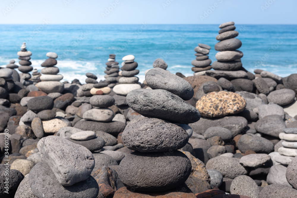 Naklejka Stone cairns on Puerto de la Cruz coast, Tenerife island, Spain
