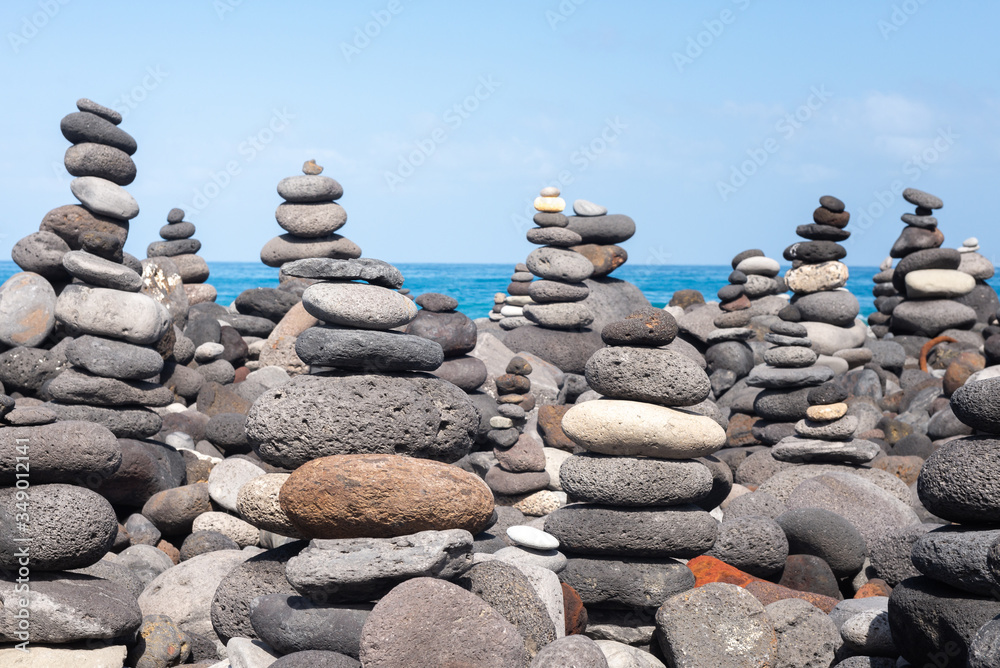 Stone cairns on Puerto de la Cruz coast, Tenerife island, Spain Stone cairns on Puerto de la Cruz coast, Tenerife island, Spain