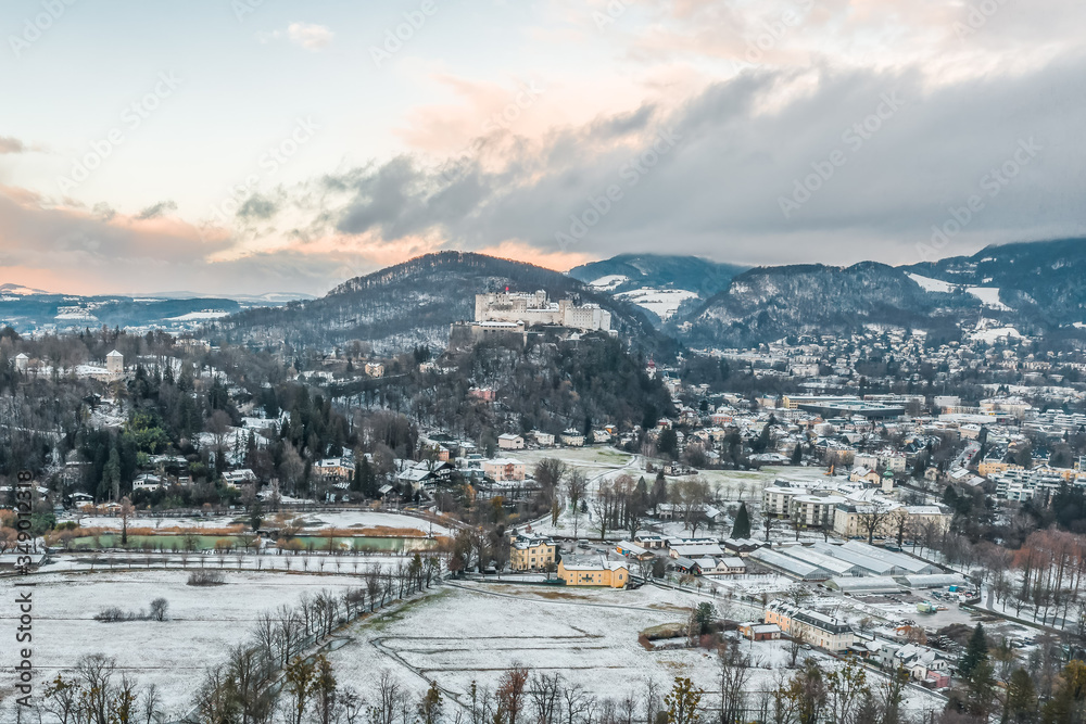 Aerial view of Hohensalzburg Fortress from southwest outskirts of Salzburg in Austria during winter