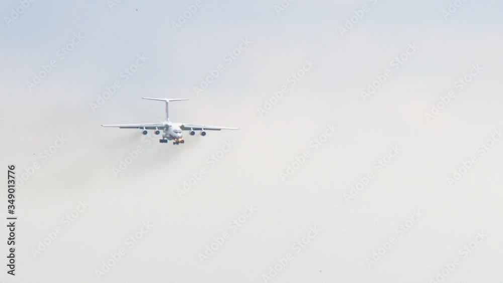 Plane going down, landing and riding on airport landing strip with a towards the camera. big airplane landing at International Airport. Comercial Aircraft FHD slow motion Plane going down, landing and riding on airport landing strip with a towards the camera. big airplane landing at International Airport. Comercial Aircraft FHD slow motion