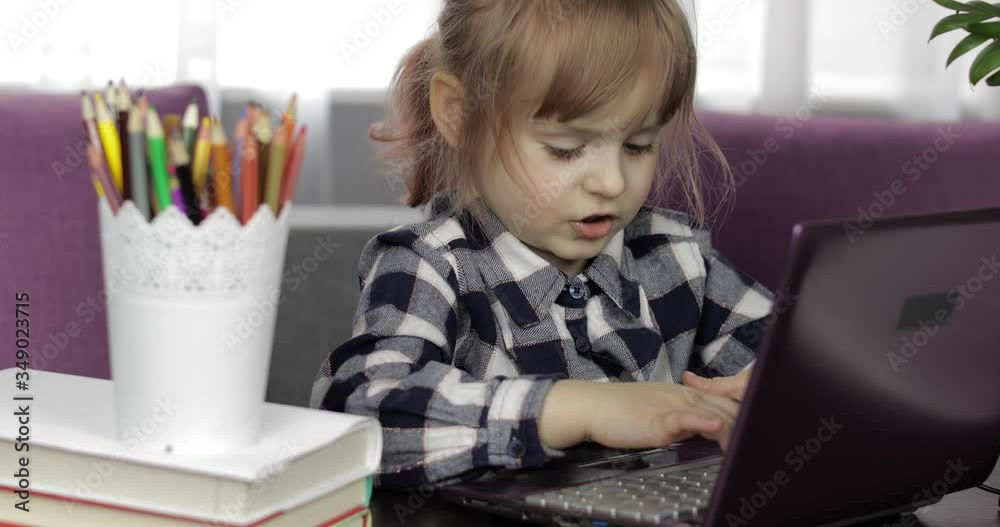 Girl studying online homework using digital laptop computer. Distance education Girl studying online homework using digital laptop computer. Distance education