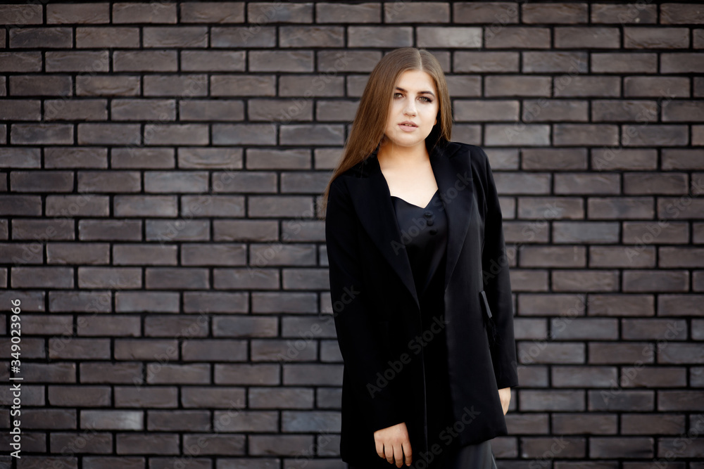 Busines woman in a stylish clothes. Business portrait of a girl. Confident business woman in stylish formal clothes and with a charming smile. Busines woman in a stylish clothes. Business portrait of a girl. Confident business woman in stylish formal clothes and with a charming smile.