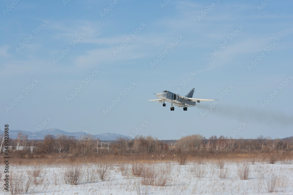 Military jet bomber Su-24 Fencer flying