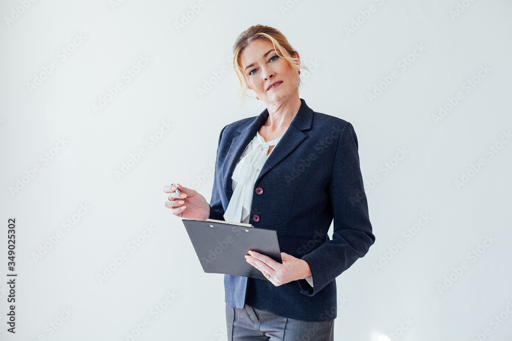 beautiful business woman holds a folder for papers beautiful business woman holds a folder for papers