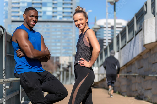 Portrait of a fit  toned  and healthy couple enjoying a sunny day outdoors in the city  muscular and slim active lifestyle
