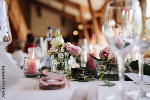 photo of flowers and candles on a wedding table