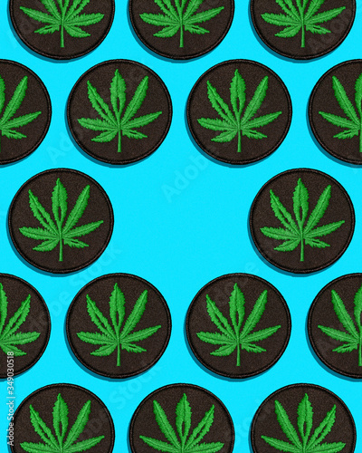 Cannabis Leaf Black Patch in Grid Pattern on Blue Background Center Empty (ID: 349030518)