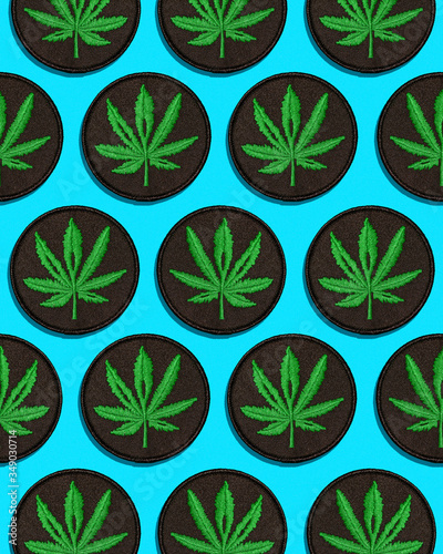 Cannabis Leaf Black Patch in Grid Pattern on Blue Background (ID: 349030714)