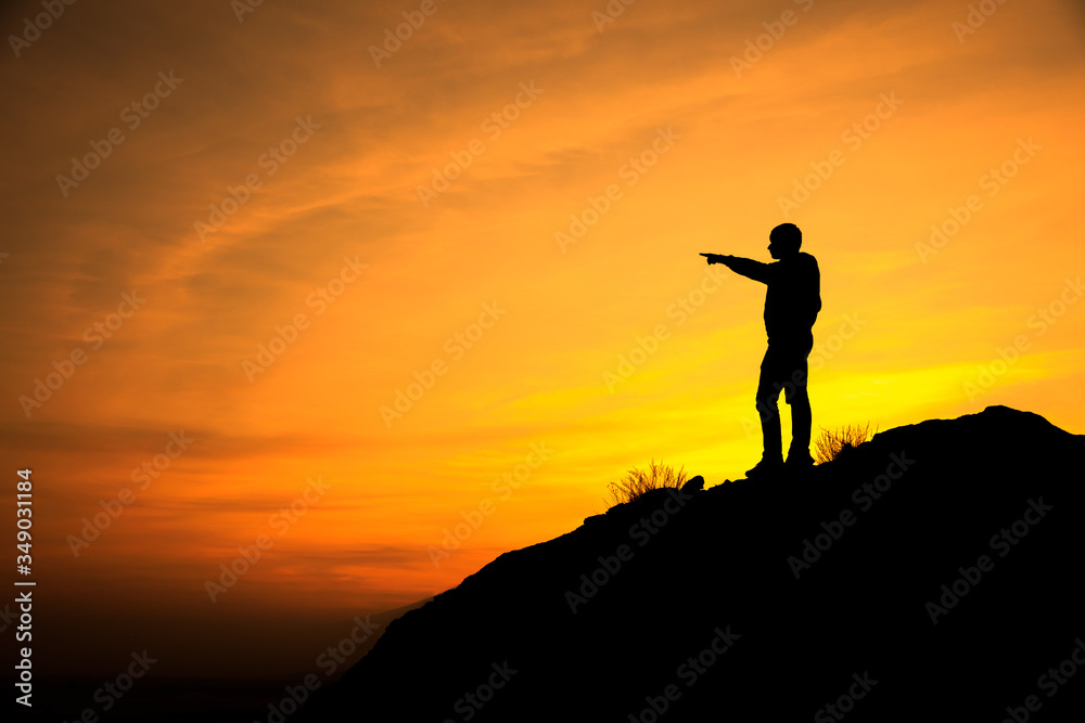 man in mountain at the sunset