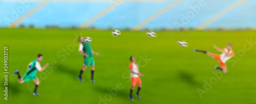 Blurred view of men playing football at stadium, banner design. Soccer match
