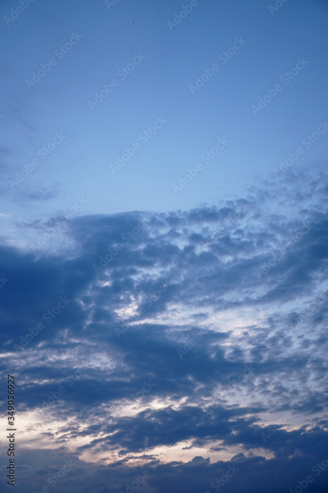 Beautiful sky on a blue background with an airplane window. White clouds of various shapes. Stock background for design Beautiful sky on a blue background with an airplane window. White clouds of various shapes. Stock background for design