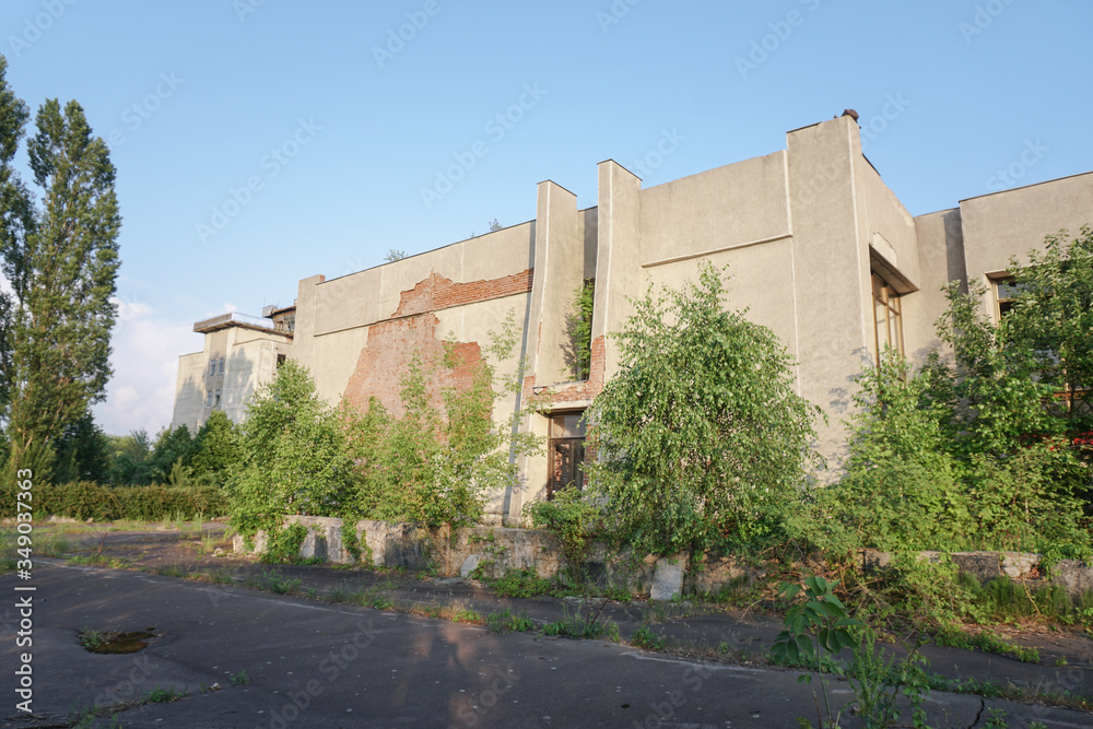 Ruins of abandoned buildings in 1986. Soviet architecture in Chernobyl. Danger of infection of people with the virus, radiation. Scary Grunge Background Ruins of abandoned buildings in 1986. Soviet architecture in Chernobyl. Danger of infection of people with the virus, radiation. Scary Grunge Background