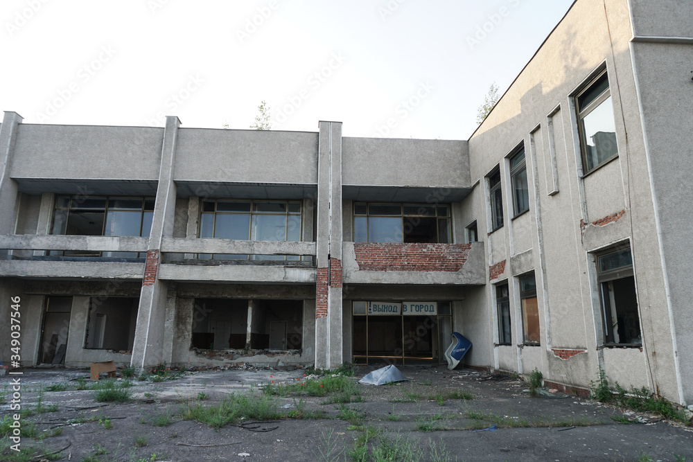 Ruins of abandoned buildings in 1986. Soviet architecture in Chernobyl. Danger of infection of people with the virus, radiation. Scary Grunge Background Ruins of abandoned buildings in 1986. Soviet architecture in Chernobyl. Danger of infection of people with the virus, radiation. Scary Grunge Background