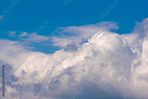 Clouds of cumulus clouds on a blue sky © Patrycja