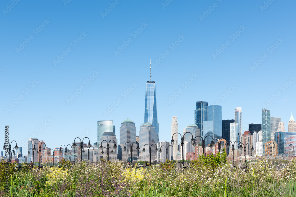 New York City Skyline with a unique, colorful flower garden and charming, quaint lighting across the panoramic foreground.