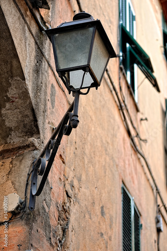 An old light lamp on a wall