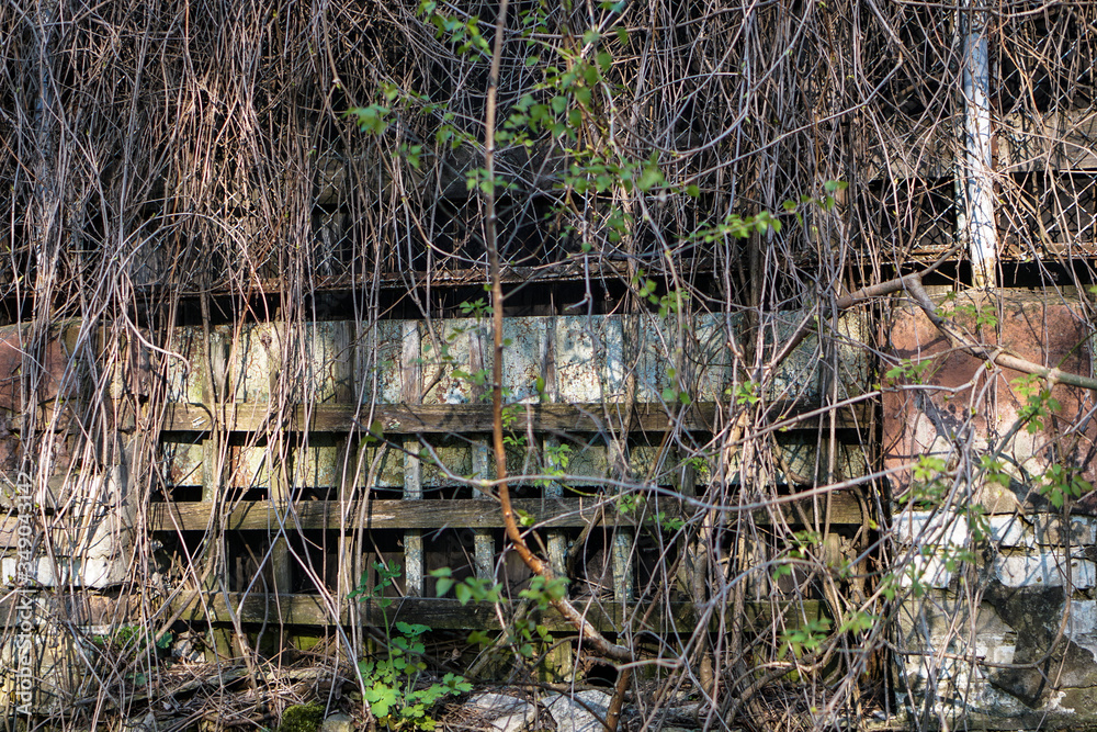 Obraz premium Ruins of abandoned buildings in 1986. Soviet architecture in Chernobyl. Danger of infection of people with the virus, radiation. Scary Grunge Background