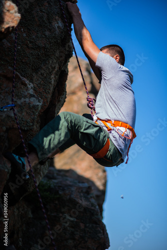 Man climbs a climbing route, extreme travel. Sport in nature