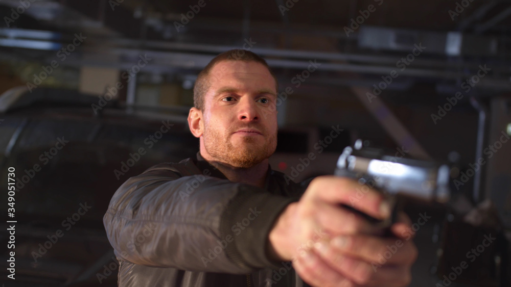 The stern man takes out a gun. Medium Close up The stern man takes out a gun. Medium Close up
