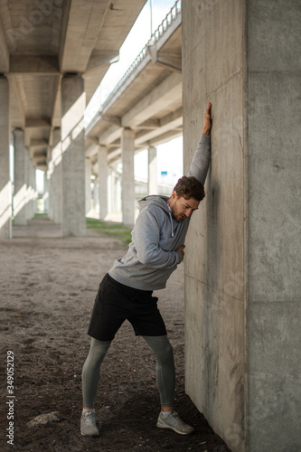 Man doing street workout alone in a city © Nejron Photo