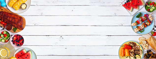 Summer BBQ or picnic food double border. Selection of grilled meats, vegetables, fruits, salad and potatoes. Above view over a white wood banner background. Copy space.