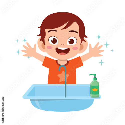happy cute little kid boy wash hand in sink
