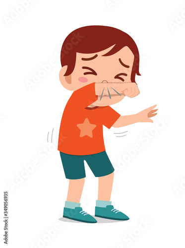 sad cute little kid boy sneeze because of flu