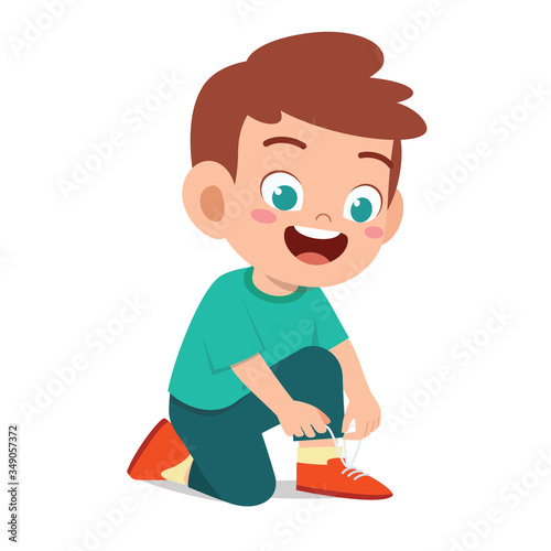 happy cute little kid boy tie shoe shoelace