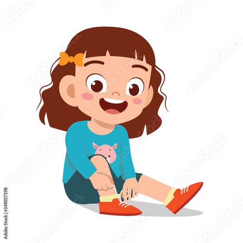 happy cute little kid girl tie shoe shoelace